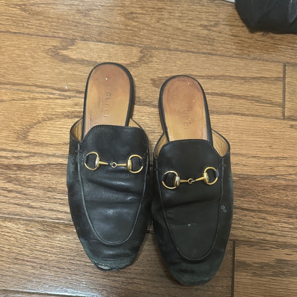 Gucci Black Leather Mules with Gold Accents